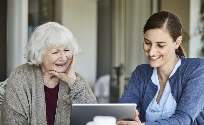 A young lady spending time with and old women